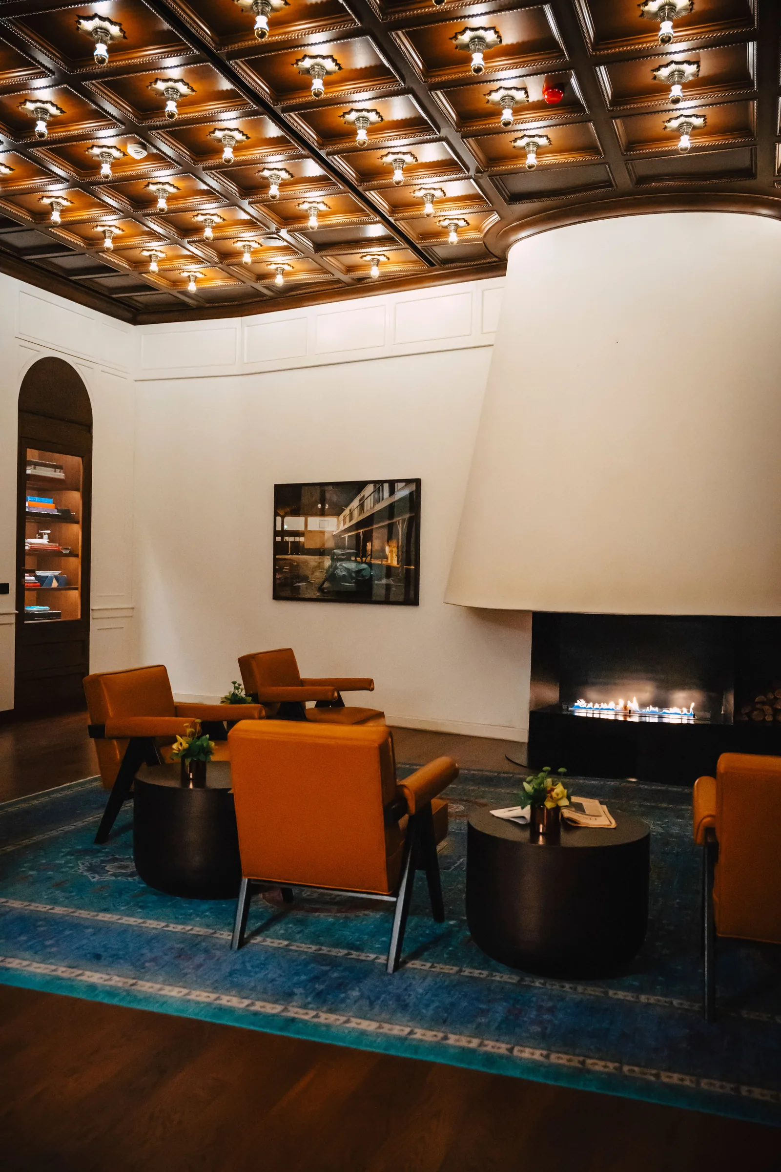 A members' club lounge with a fireplace